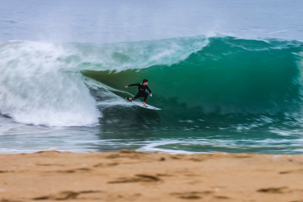 Surfers and bodyboarders risk the waters for big waves after a nearby shark attack at Wedge, Newport Beach, CA.