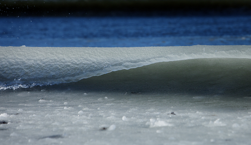 slushy ice wave on very cold morning.