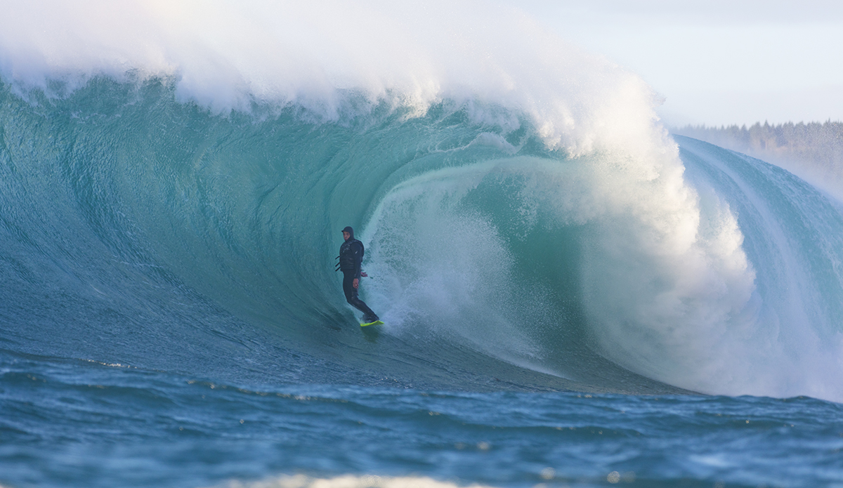 Nat Parsons rides a big wave at a remote reefbreak near Dunedin, New Zealand.