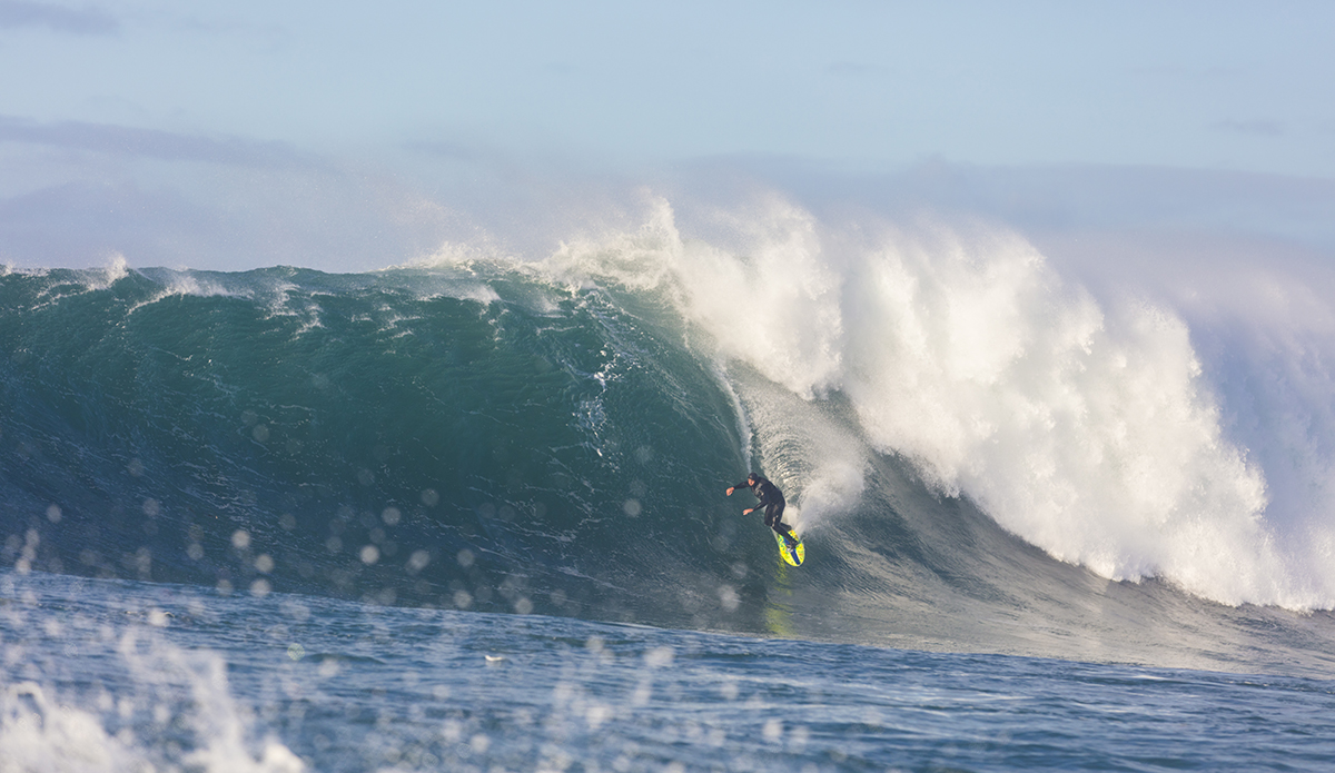 Nat Parsons rides a big wave at a remote reefbreak near Dunedin, New Zealand.