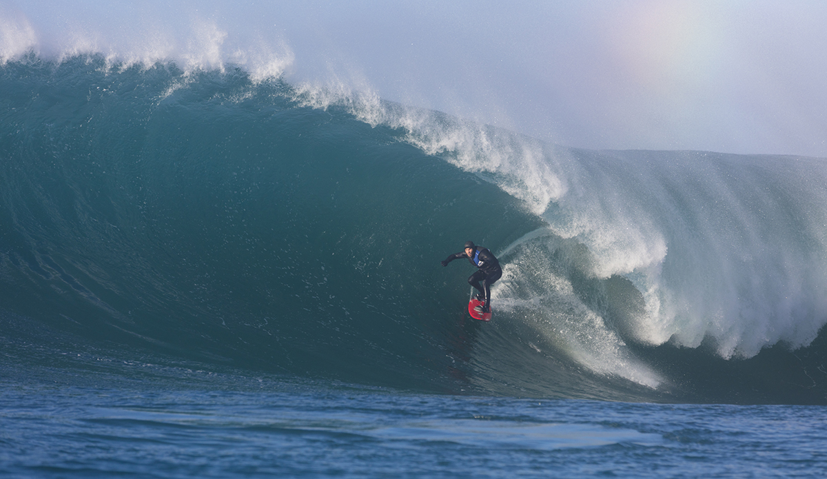 Dale Hunter revels in large surf conditions at a remote reefbreak near Dunedin, New Zealand.