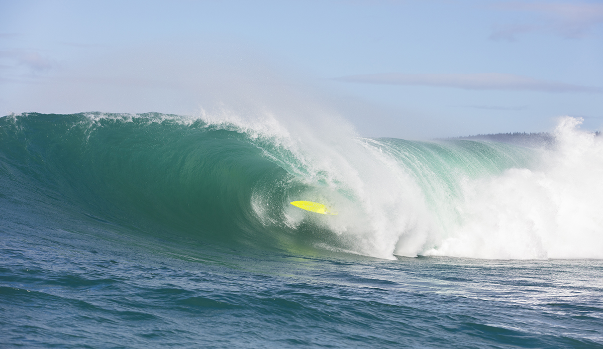 Big wave surfers tow-in at a remote reefbreak near Dunedin, New Zealand.