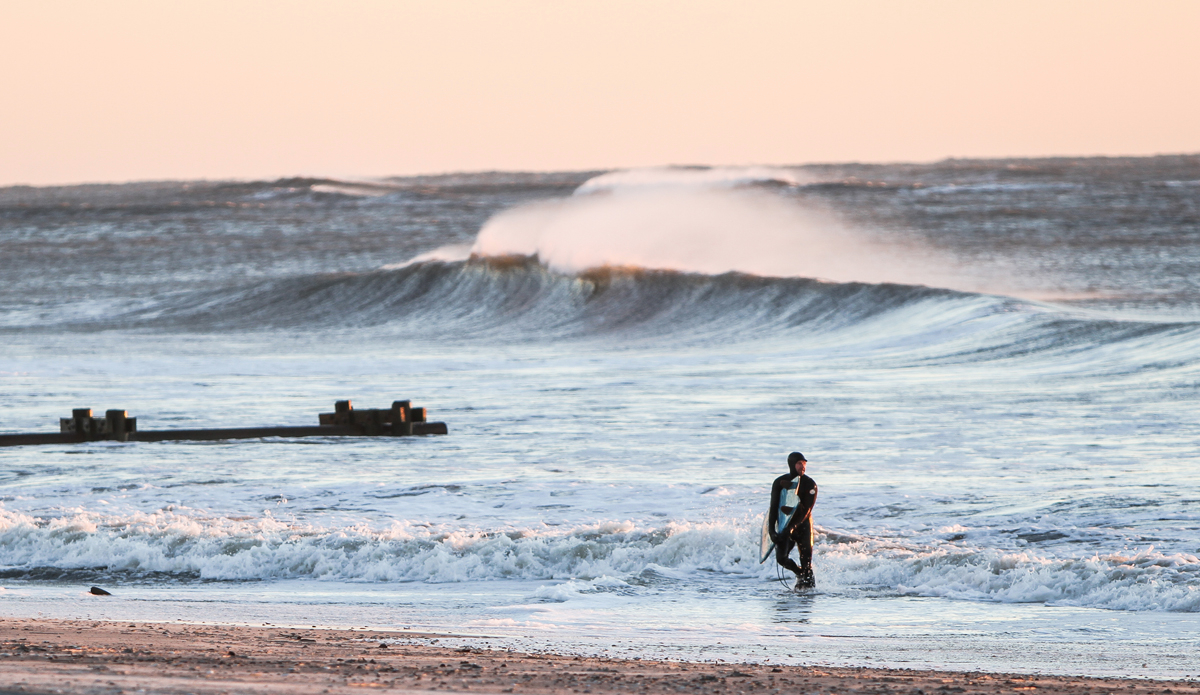 exiting-water-with-wave-in-back