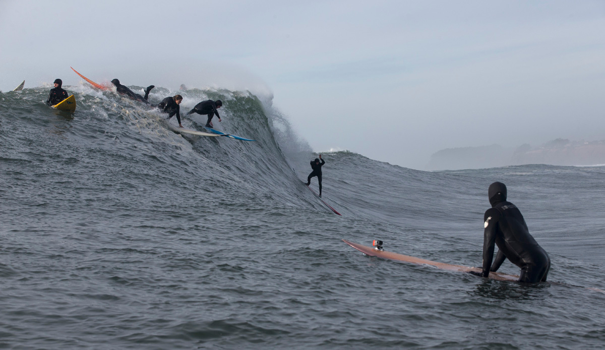 emi-erickson-10-w-savannah-shaughnessy-looking-on-unknown-surfer-red-board-turquoise-detail-mavs-dec-7-2015