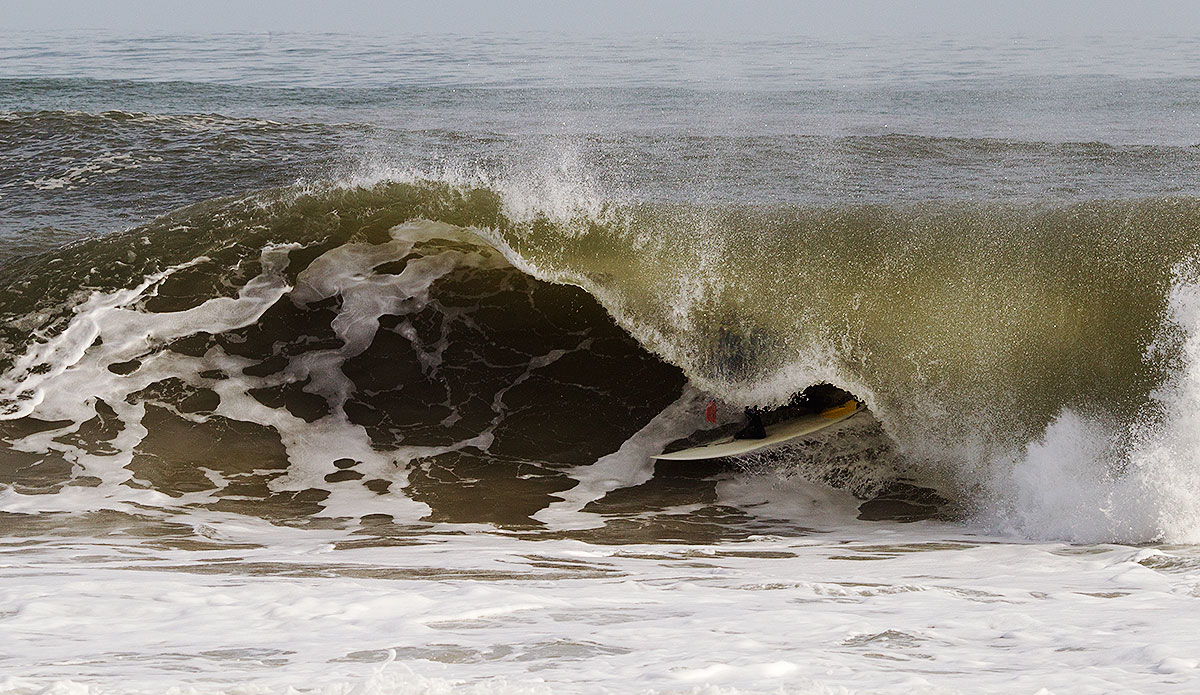 noah-snyder-in-a-solid-shorebreak-barrel