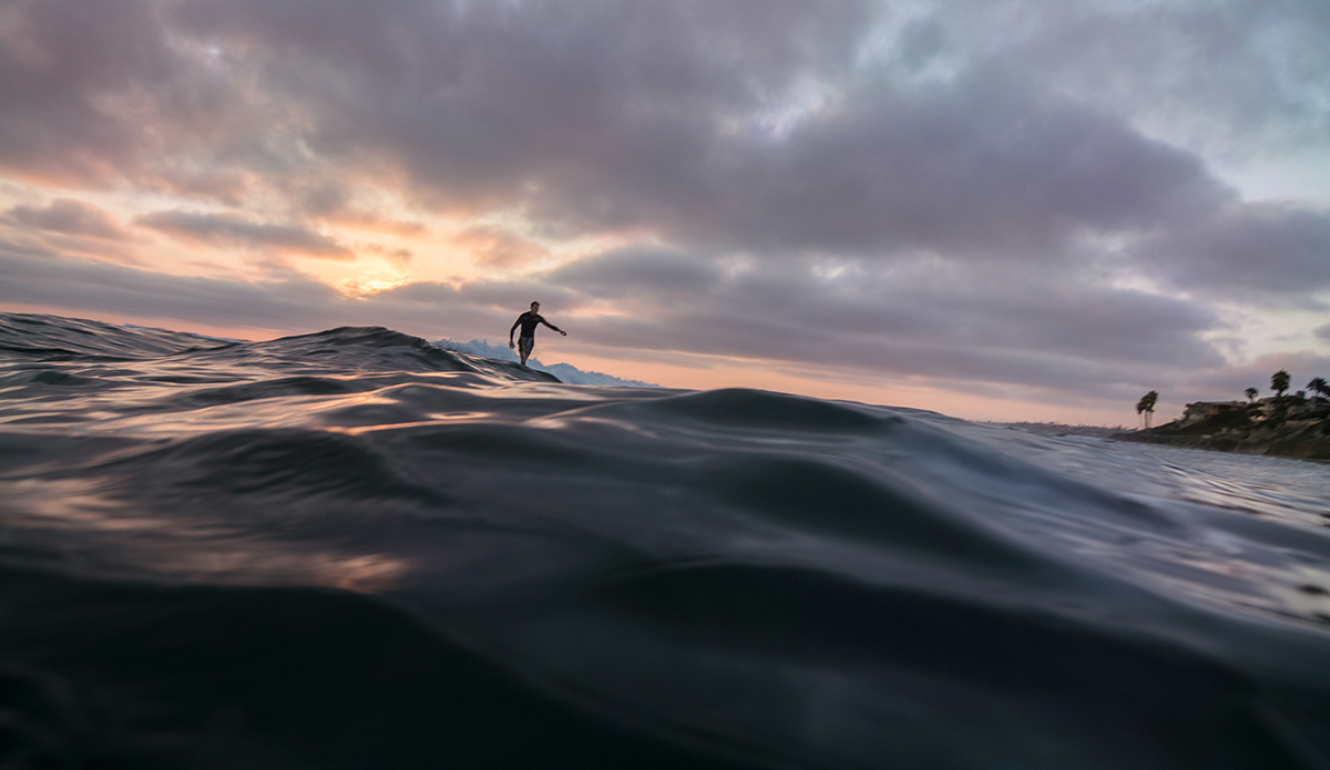 Sam Cadwallader logging through a San Diego summer sunset.