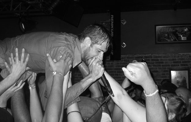 "With music, you don’t lose out on anything because you’re too tall or you’re too short or you’re too ugly or you’re too good looking," says The Riverboat Gamblers' Mike Wiebe. Mike Wiebe of The Riverboat Gamblers crowd surfs at The Slide Bar in Anaheim