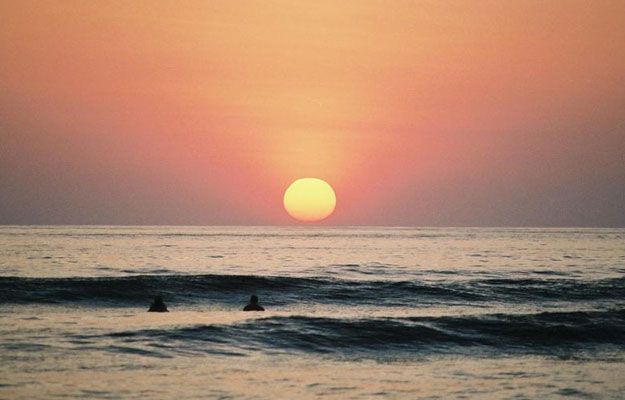 Sunset Lineup Surfing