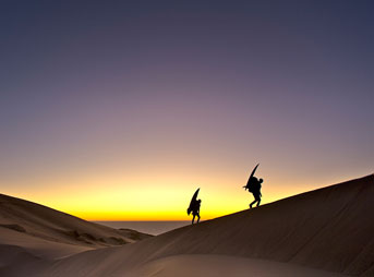 Surfers travel desert