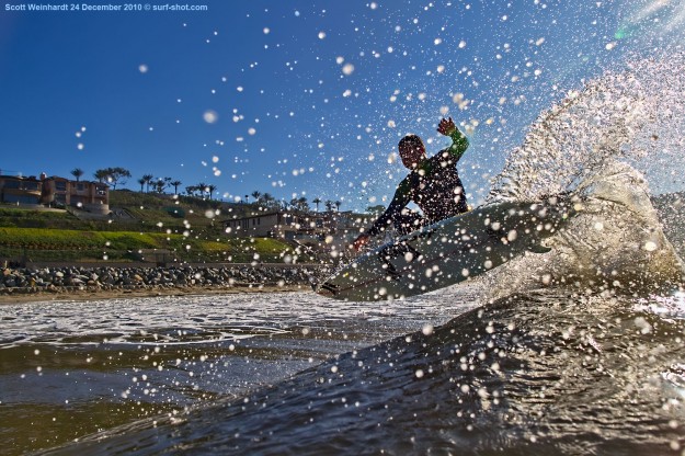 Instead of issuing fines, the Harbor Patrol heckled us for a couple of minutes: “Did you see the signs? Do you know you’re swimming in poo?” Scott Weinhardt doesn't seem to mind much. Photo: Chuck Schmid/Surf-Shot.com Surfing Polluted Water