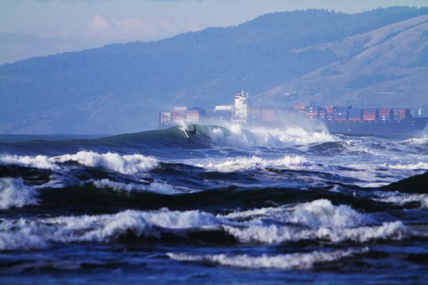 A tanker ship passes by a surfer at Ocean Beach. Photo: Seth Migdail/SFGate.com A tanker ship passes by a surfer at Ocean Beach. Photo: Seth Migdail/SFGate.com