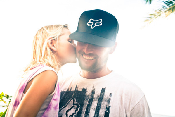 Father Damien gets an endearing kiss from his daughter. Photo: Justin Jay