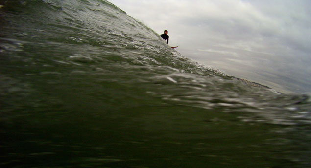 "When the first green wall—tall as a four-story building—marches off the horizon and pushes onto the reef, the base of the wave – the cauldron, as it’s called – drops below sea level, sucking in its gut." Photo: Mark Lukach