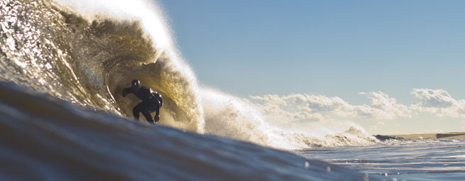 January capped off with a bang of icy swell on the East Coast, and a trip to the Outer Banks yielded a barrel full of fine waves. Cold winter's never felt so warm.