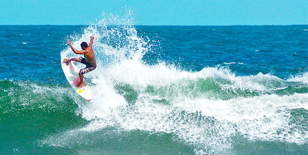 Professional surfer Willy Correa has seen the landscape of Itacare change, as more palm trees are cut down for hotel development and rainforest sacrified for monocroping - an agricultural practice of planting only one crop, often destroying the soil. Photo: Surf Channel/Shannon Q