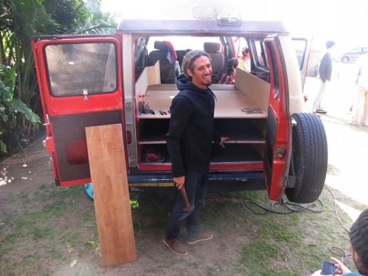 Rob Machado working on his ultimate surf van.