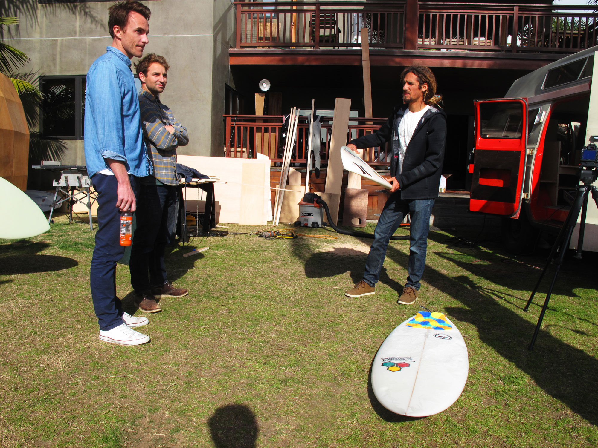 Director Tyler Manson, artist Jay Nelson, and Rob Machado prepare for a surf break. Director Tyler Manson, artist Jay Nelson, and Rob Machado prepare for a surf break.