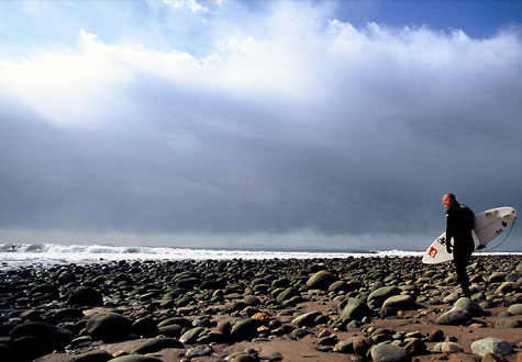Kelly Slater walks out on the cobblestone rocks at Lower Trestles for a surf at the iconic Southern California break. Photo: Aroyan Kelly Slater walks out on the cobblestone rocks at Lower Trestles for a surf at the iconic Southern California break. Photo: Aroyan
