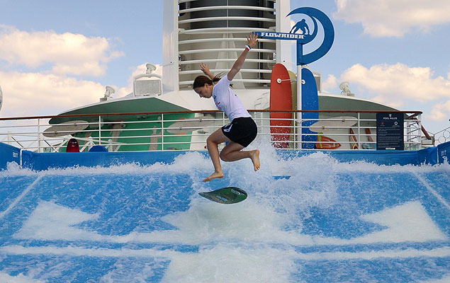 Xana-Kai Nash, World Flowboard champion, pops a shuv-it on the Flowrider. Photo: Royal Caribbean