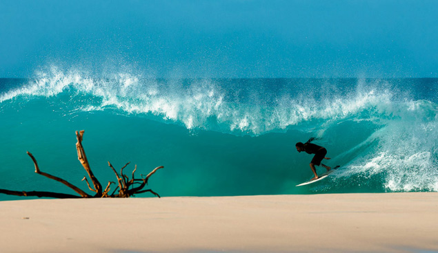 Dylan Graves driving through a Caribbean tunnel. Photo: Chris Burkard