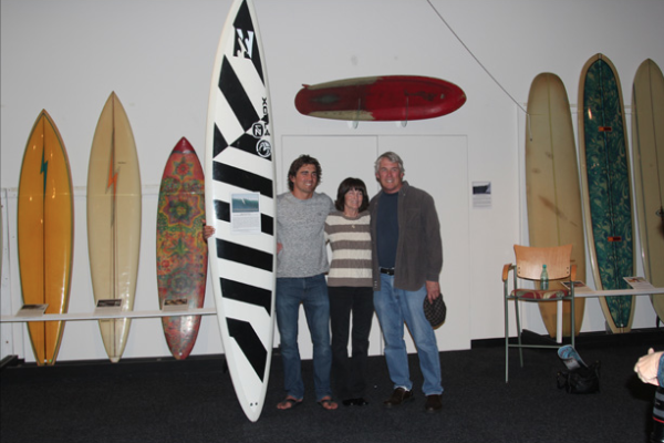 Greg with mom, dad and his winning board from the 2009 Eddie.