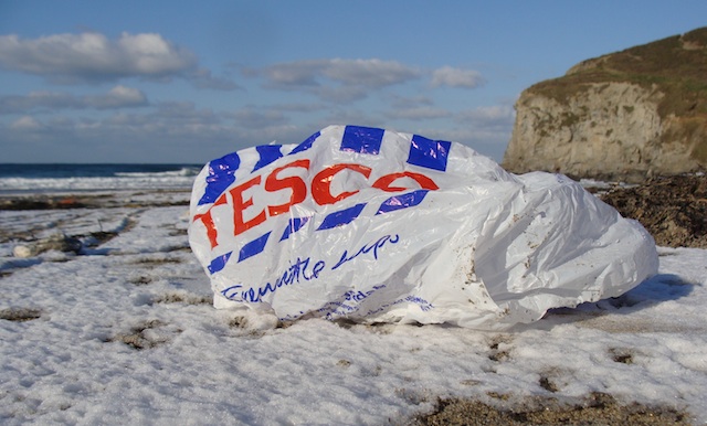Plastic bags liter a beach in Cornish. Photo: Surfers Against Sewage