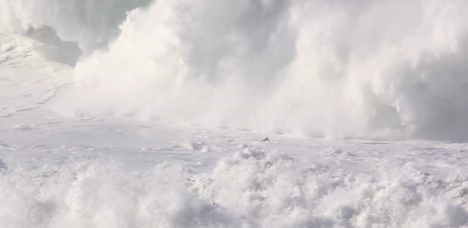The black speck in front of the incoming surge of whitewater is Alex Martins grabbing a quick breath of oxygen.