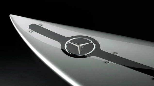 Flat hood ornament = less drag. 