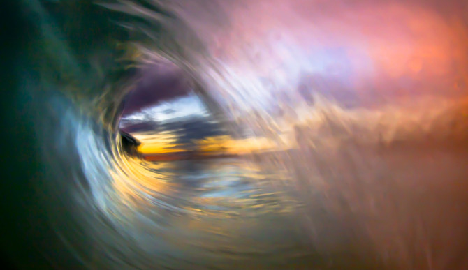 This image sparked my desire to shoot abstract waves. A perfect barrel framing the rich colors of the sunset on the horizon. My favorite image to date.