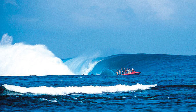 The Millenium Wave. It's clear from the reaction on the boat that something major is happening. Photo: Sean Davey