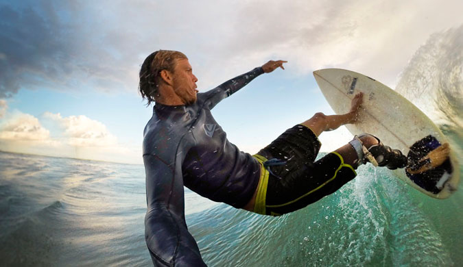 Top turn shot with the Hero 3+. This Merrick is a magic board given to me by Bethany Hamilton. GoPro made me this neat surf handle that works well. A bit akward to paddle with it in your mouth though as it feels like I am getting waterboarded. Photo: Mike Coots