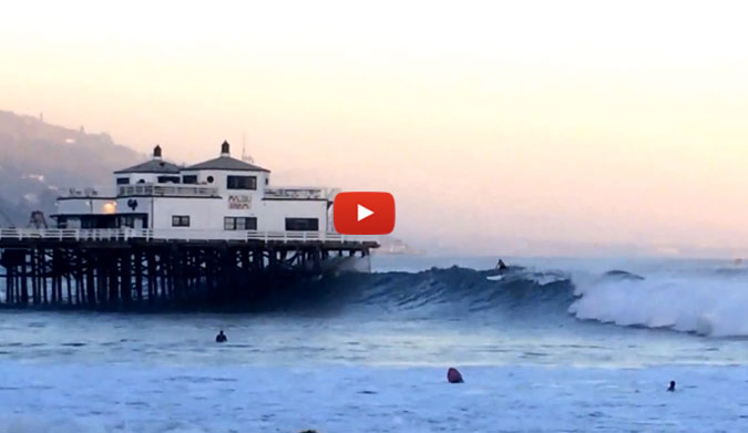 He proceeded to stroke into the largest set wave of the day. And then, of course, he shot the pier. On a paddleboard.