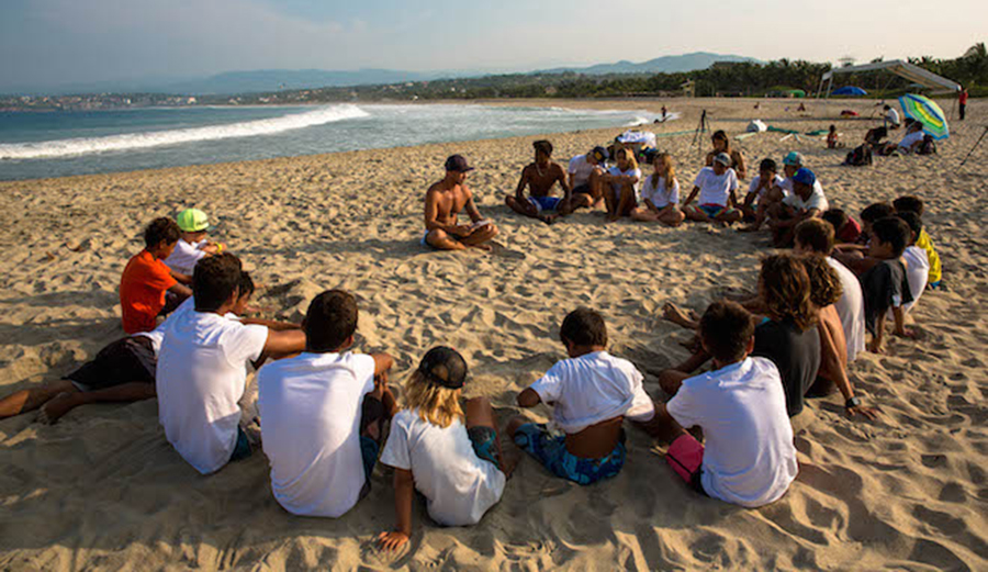 A pre-surf pow wow around local legend Coco Nogales. Photo: Courtesy of Nicholas Mohnacky