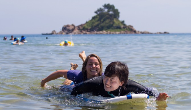 In the end, these smiles broke through the clouds of misperception — at least in the context of the coastline. Photo: Bridget Kaleki