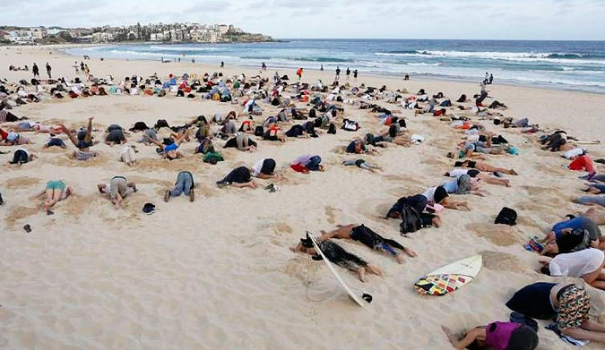 Many believe that Tony Abbott has his head in the sand when it comes to climate change. Photo: Mic.com