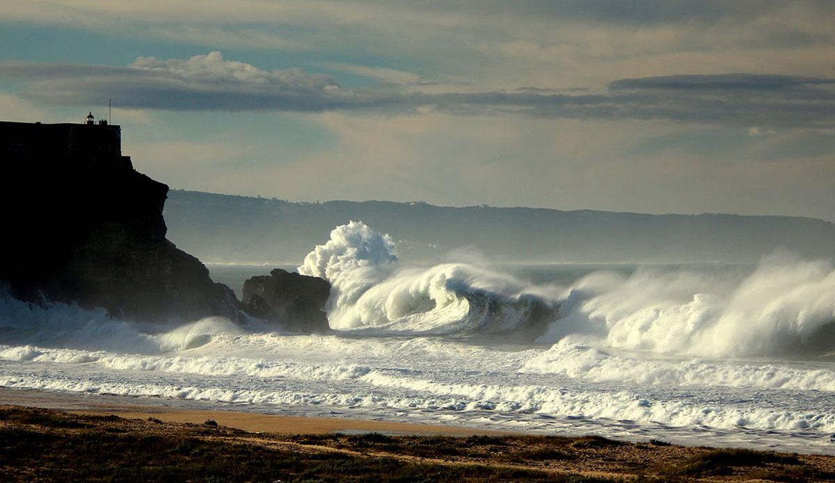 It was out-of-this-world beautiful – the sun was just peeking over the edge the ocean, the colors of the sky were astonishing, and the waves were truly huge.