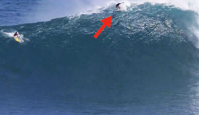 Even while he's jammed in a giant lip with a Peahi wind is howling under his board, he's fully committed to making that wave.