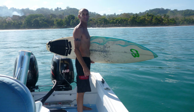 Dean Parker ditches his board for a rifle. Photo: Facebook
