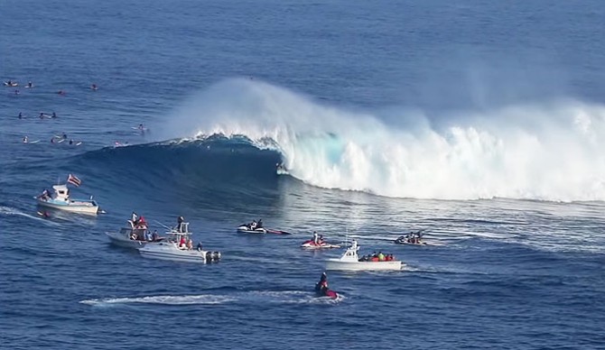 Watch the regular footer pull into a clean tube amidst a packed lineup, slot herself perfectly into classic Jaws barrel, and emerge unscathed in classic Alms fashion.