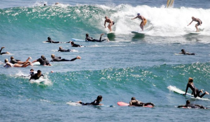 Zachary Winkler is the first surfer . Photo: Shetler