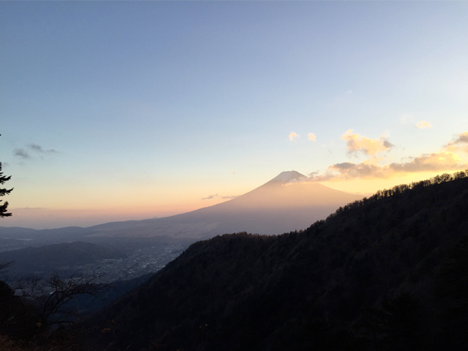 Shot by Taketo Y. in Yamanashi, Japan; a stark foreground can make a background subject feel grander. The dark landscape here adds a majestic quality to the view of the mountain. App Used: Camera
