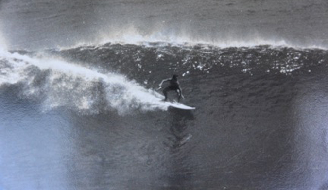 Bill Boyum enjoying perfect waves and an empty lineup .
