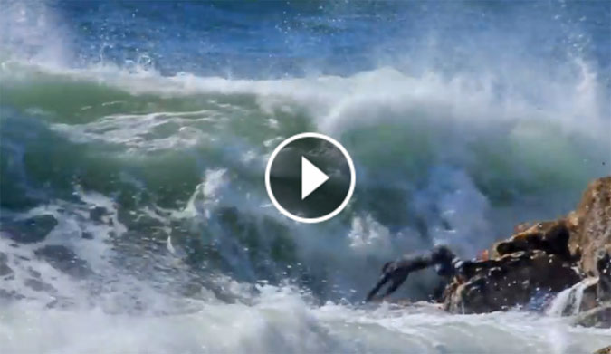 Miguel Blanco dives headfirst into rocky waters.