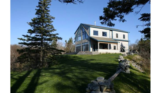 Haven't you always wanted your very own windmill? This house comes with one.