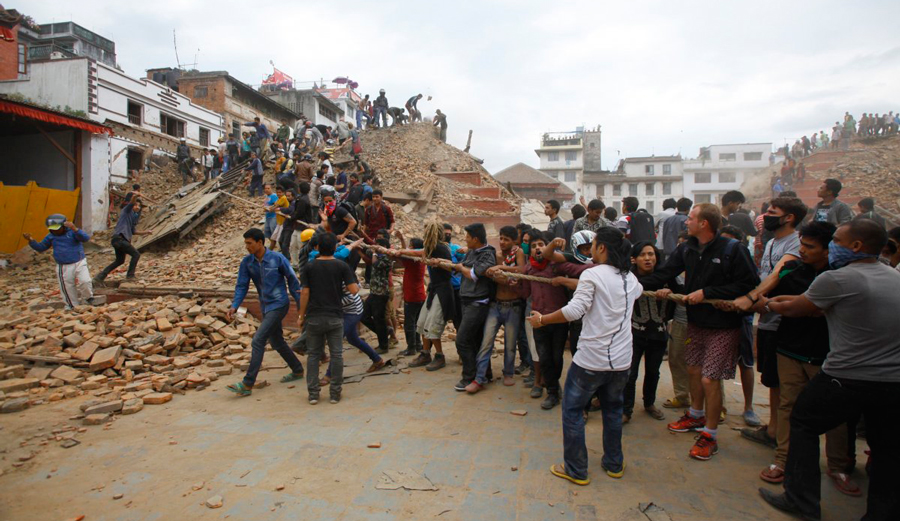 Volunteers removing debris at Durbar Square in Kathmandu. Photo: Niranjan Shrestha via AP