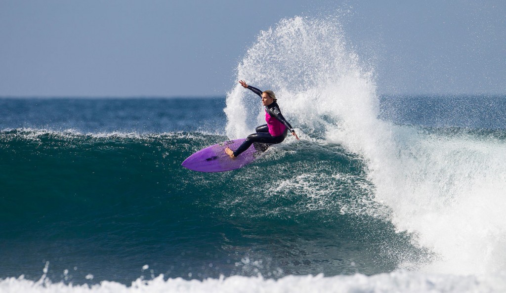Dimity Stoyle with a large, stickerless section on the nose of her board. As one of the best female surfers in the world, how can that be?