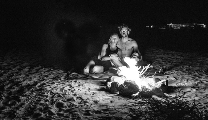 Enjoying one another's company over a lovely bonfire.