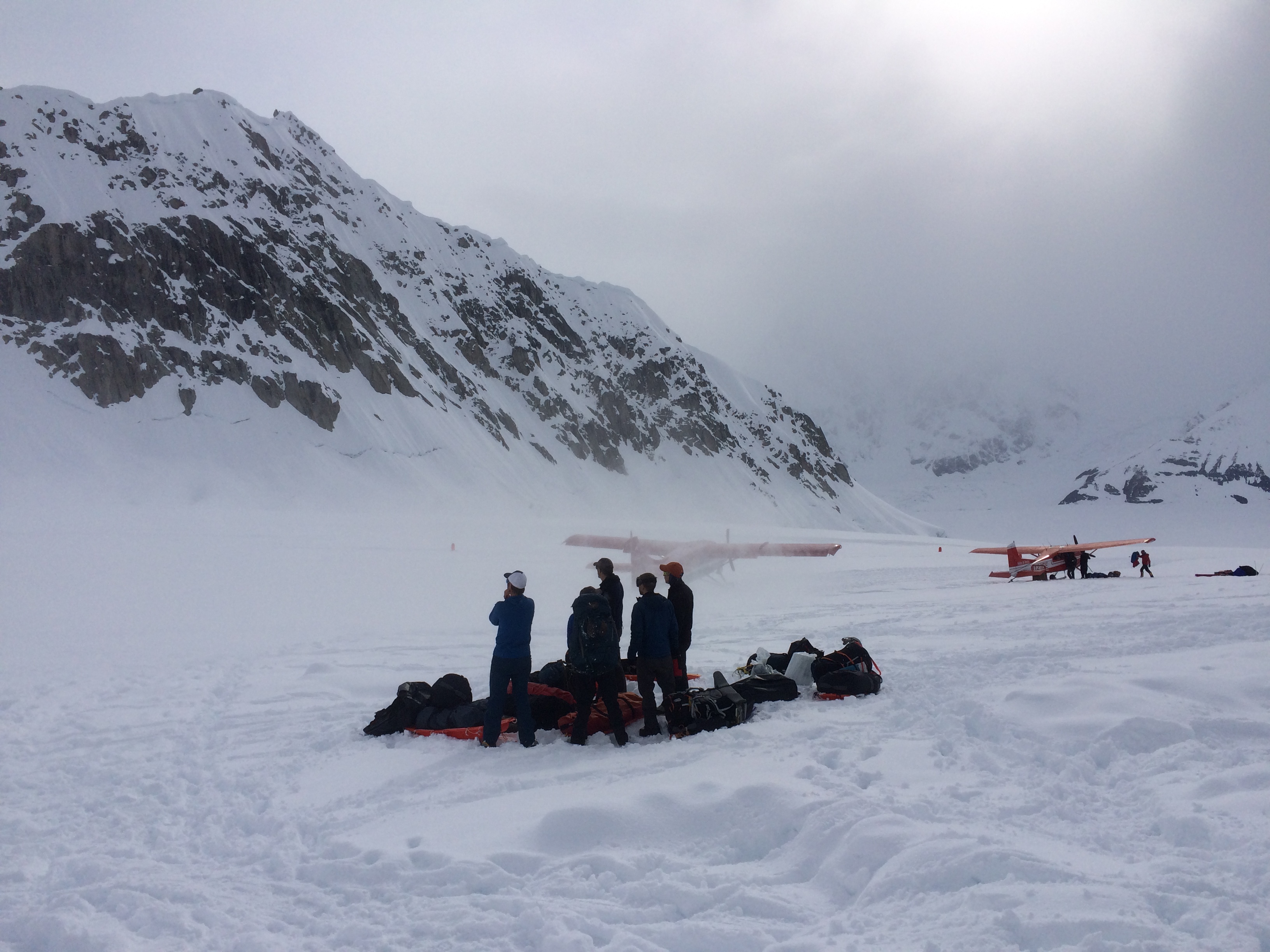 After a several-day weather hold, large queues of climbers awaiting transport built up both at basecamp and in town. When the weather finally broke, basecamp truly earned its nickname of “Kahiltna International Airport”.