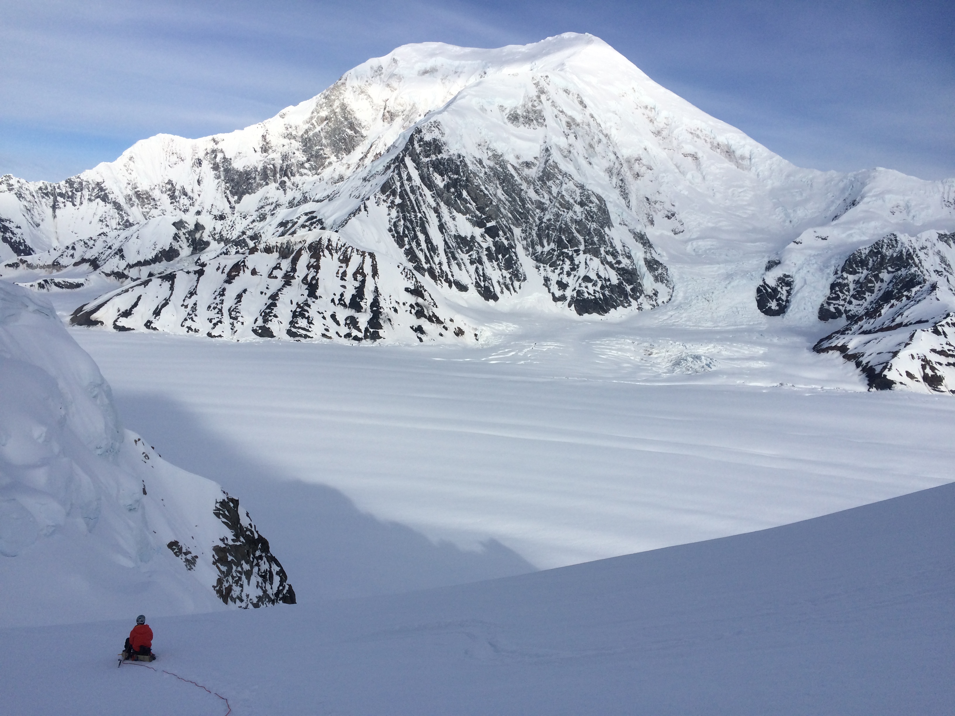 Peter contemplates the enormity of Mt. Foraker and the Alaska Range from beneath the Cat’s Ears on Mt. Hunter.