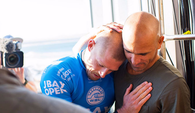 Shark attack! Kelly Slater! Mick Fanning! Hugging! Television gold!